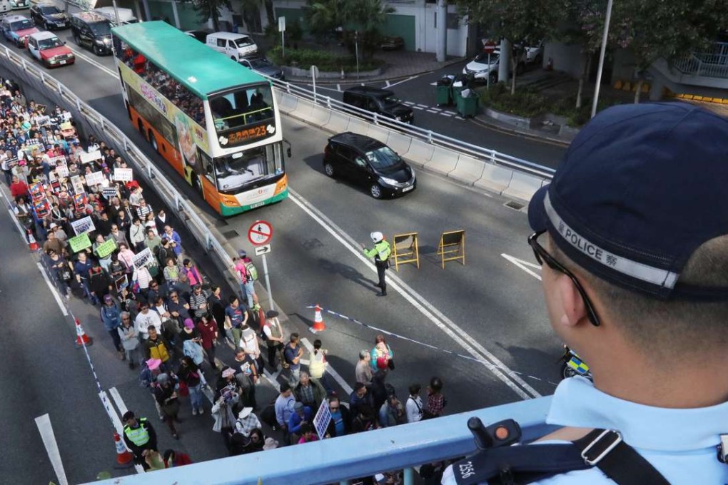 Supporters of the seven police officers march to the police headquarters from Chater Garden. Photo: Felix Wong