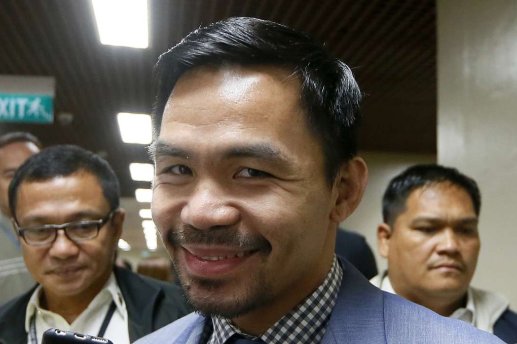Filipino boxer and senator Manny Pacquiao has confirmed he is talking to Britain’s Amir Khan about a possible fight. Photo: AP