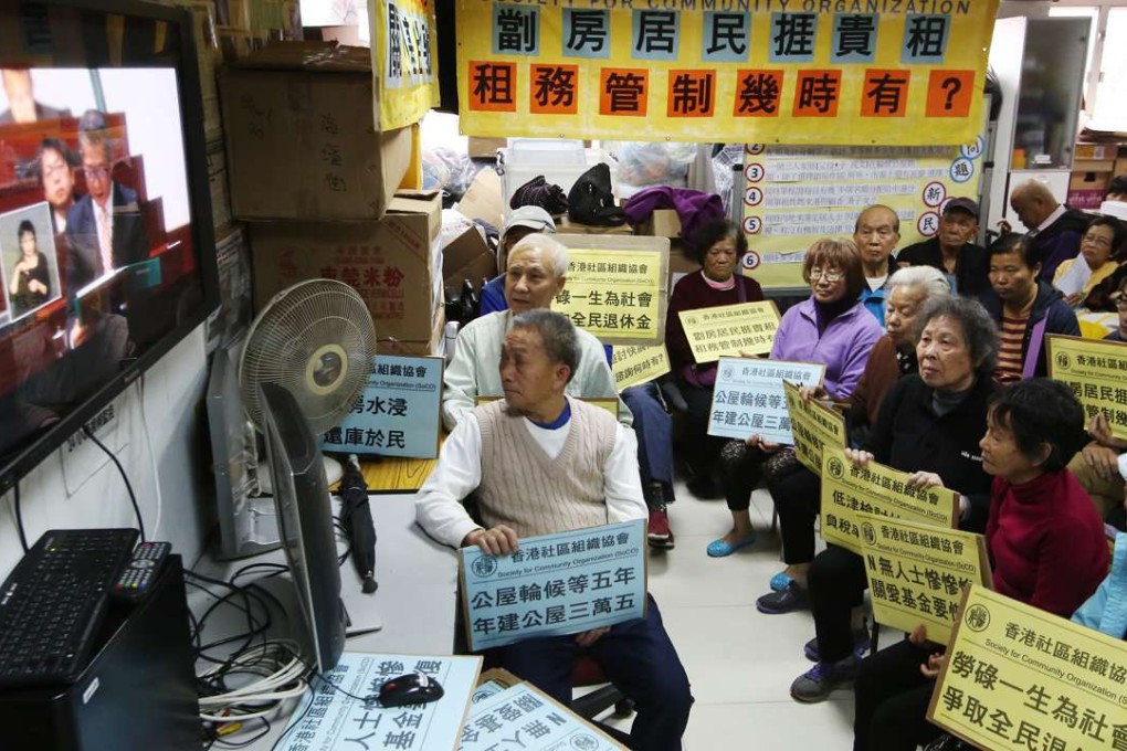 Hongkongers watch Financial Secretary Paul Chan Mo-po deliver his budget. Photo: Edmond So