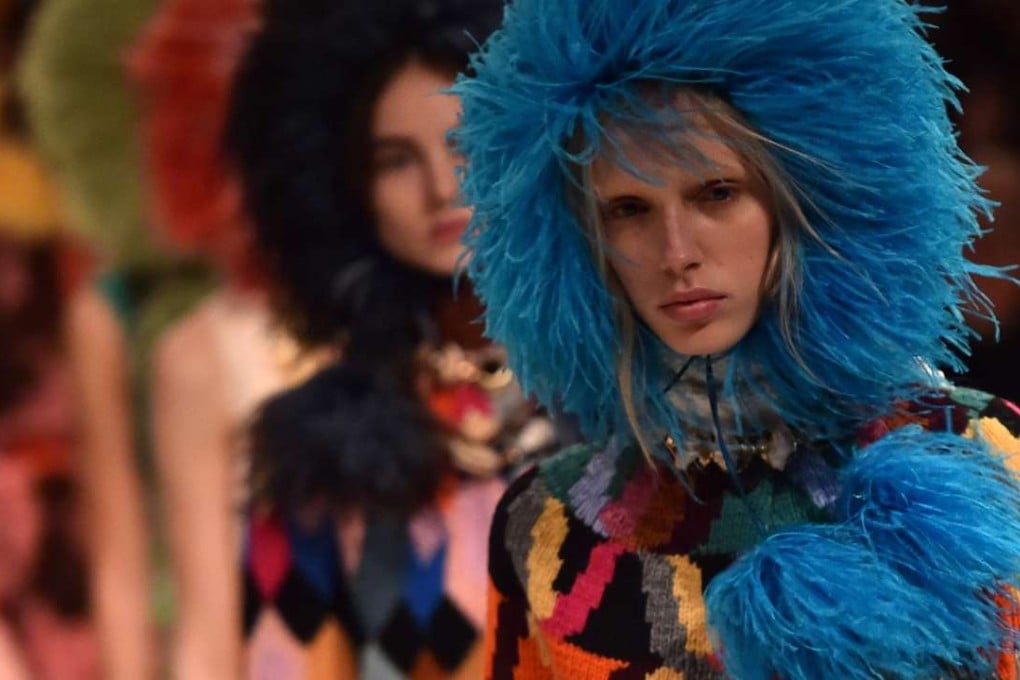 Models rugged for autumn/winter present colourful knitwear for Prada during fashion week in Milan. Photo: AFP