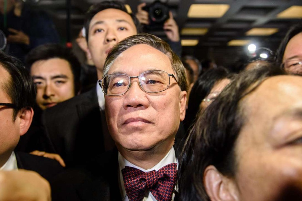 Former Hong Kong chief executive Donald Tsang (centre), 72, leaves the High Court after the jury found him guilty of misconduct in his high-profile corruption trial in Hong Kong. Photo: AFP