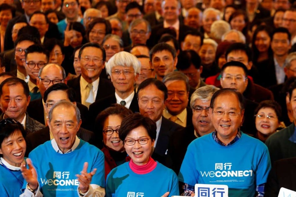 Chief executive contender Carrie Lam poses with her supporters during the launch of her campaign on February 3. Can her rich and powerful backers really help to bring about the “new style of government” she promises, solve housing problems and offer a “new vision”? Photo: Reuters