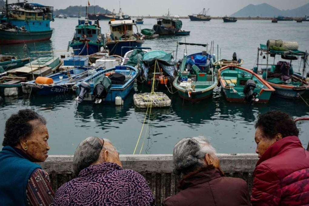 Women chat at the Cheung Chau harbourfront. Hong Kong is a microcosm of the grossly unequal reality we see globally, with the richest 10 per cent of the city’s households earning 29 times more than the poorest 10 per cent. Photo: AFP