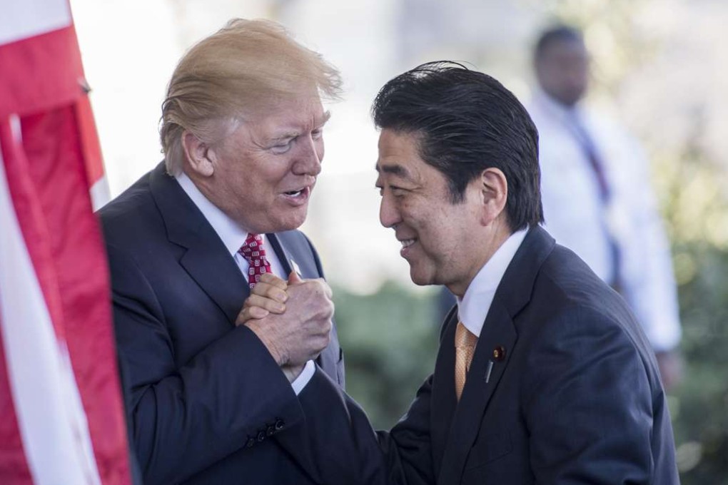 Japanese Prime Minister Shinzō Abe is greeted by President Donald Trump as he arrives at the White House in Washington, D.C. Must credit: Washington Post photo by Melina Mara