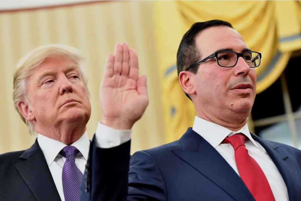 US President Donald Trump watched on as Steven Mnuchin took the oath of office on January 13 as Treasury secretary. In a Reuters interview hours after Mnuchin spoke to CNBC, Trump appeared to contradict his Treasury chief over whether to label China as a currency manipulator. Photo: Pool via Bloomberg