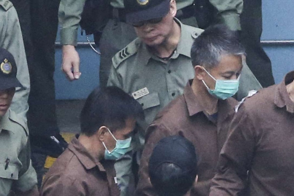 Some of the policemen jailed for the assault of Ken Tsang in the Occupy protests leave the Lai Chi Kok Reception Centre. Photo: Felix Wong