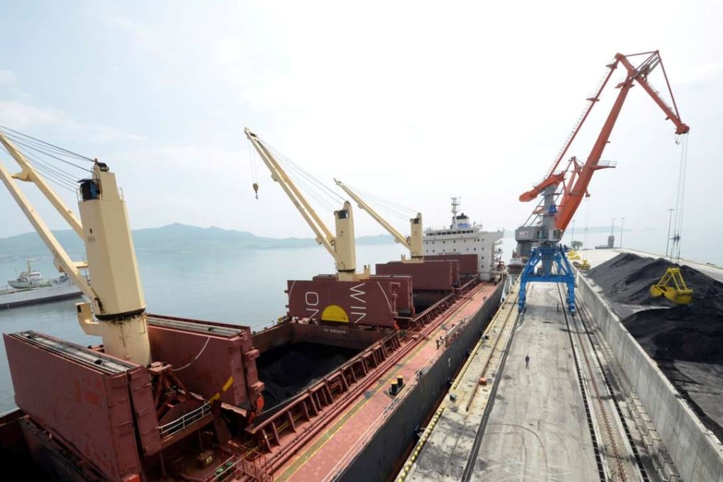 A cargo ship is loaded with coal during the opening ceremony of a new dock at the North Korean port of Rajinin 2014. Coal is estimated to take up as much as 40 per cent of North Korea’s exports to China. Photo: Reuters