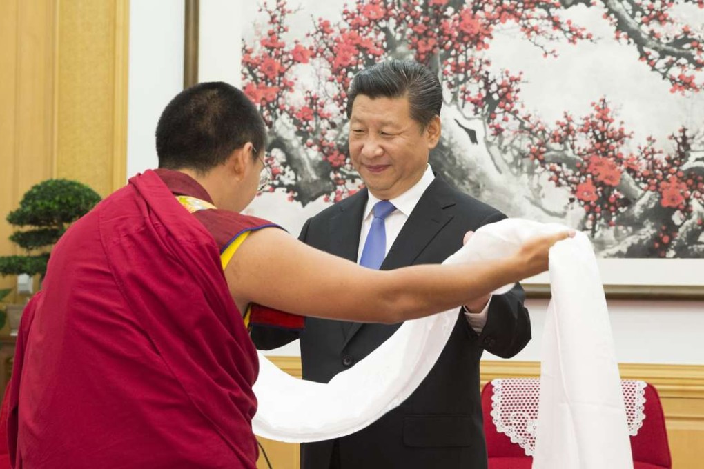 The 11th Panchen Lama, left, presents a Tibetan prayer scarf to President Xi Jinping in Beijing in June 2015. Photo: Xinhua