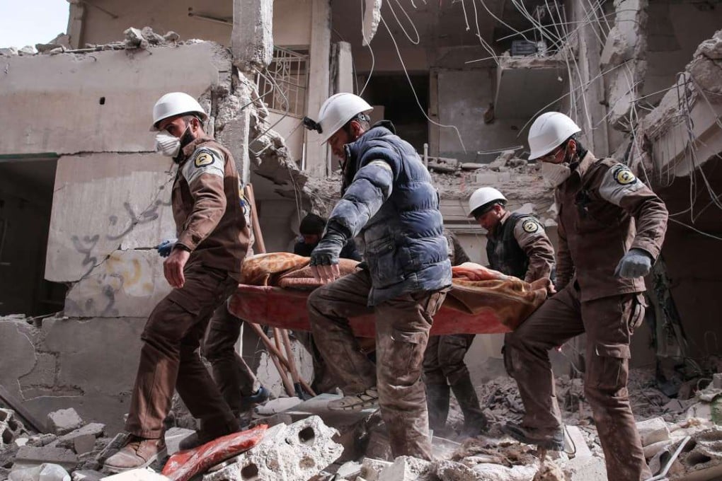 Syrian civil defence volunteers, known as the White Helmets, search for survivors following reported government air strike on the rebel-held neighbourhood of Tishrin, on the northeastern outskirts of the capital Damascus. Photo: AFP