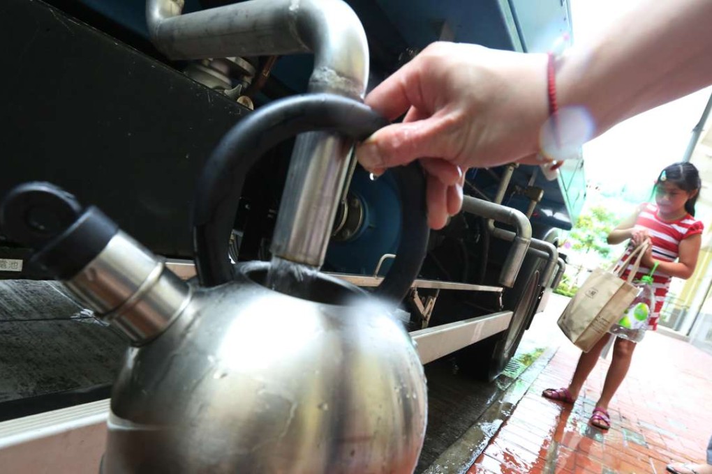 Residents of a housing estate in Hong Kong stock up on water. Photo: Felix Wong