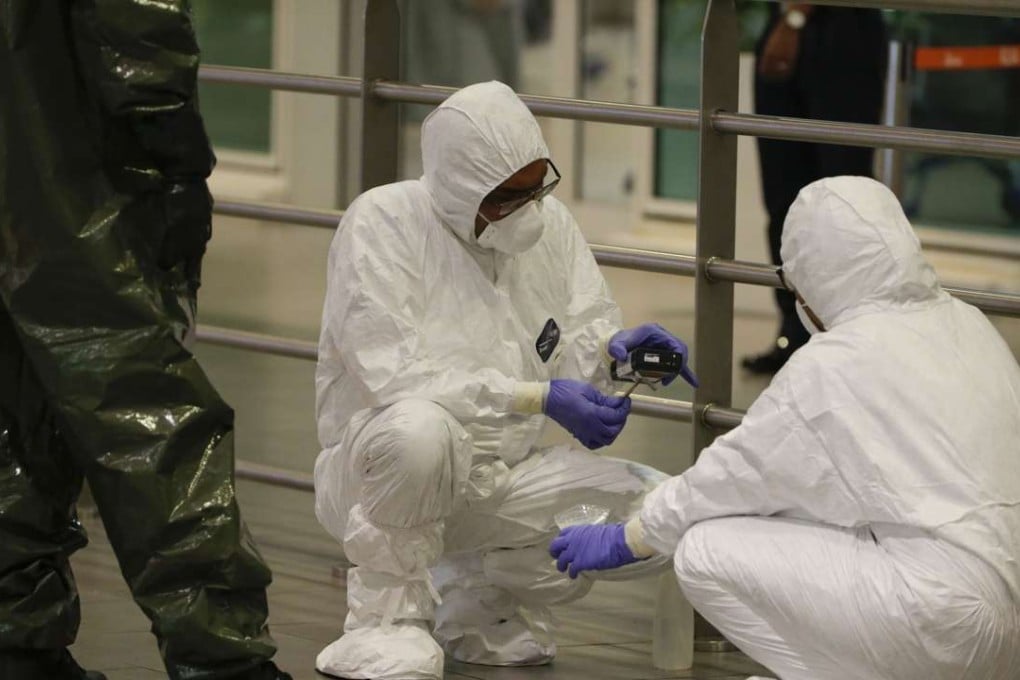 A Hazmat (hazardous materials) team conducts checks inside Kuala Lumpur Internatinal Airport 2 (KLIA2) airport terminal. Photo: EPA