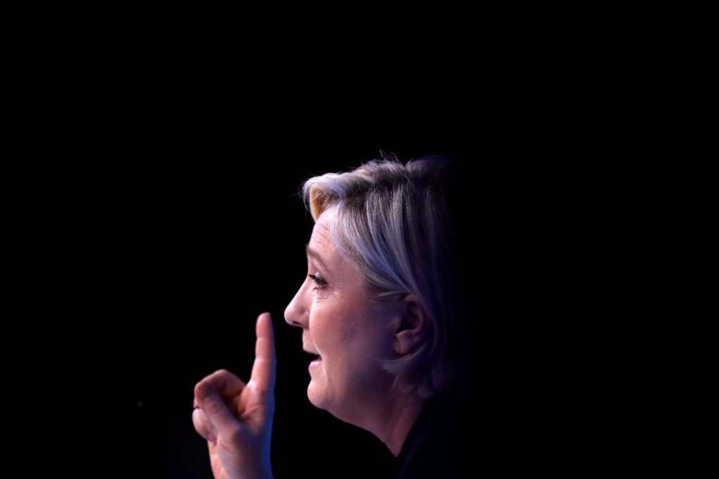 Marine Le Pen, French National Front (FN) political party leader and candidate for the 2017 presidential election, attends a meeting focused on civil works in Paris. Photo: Reuters