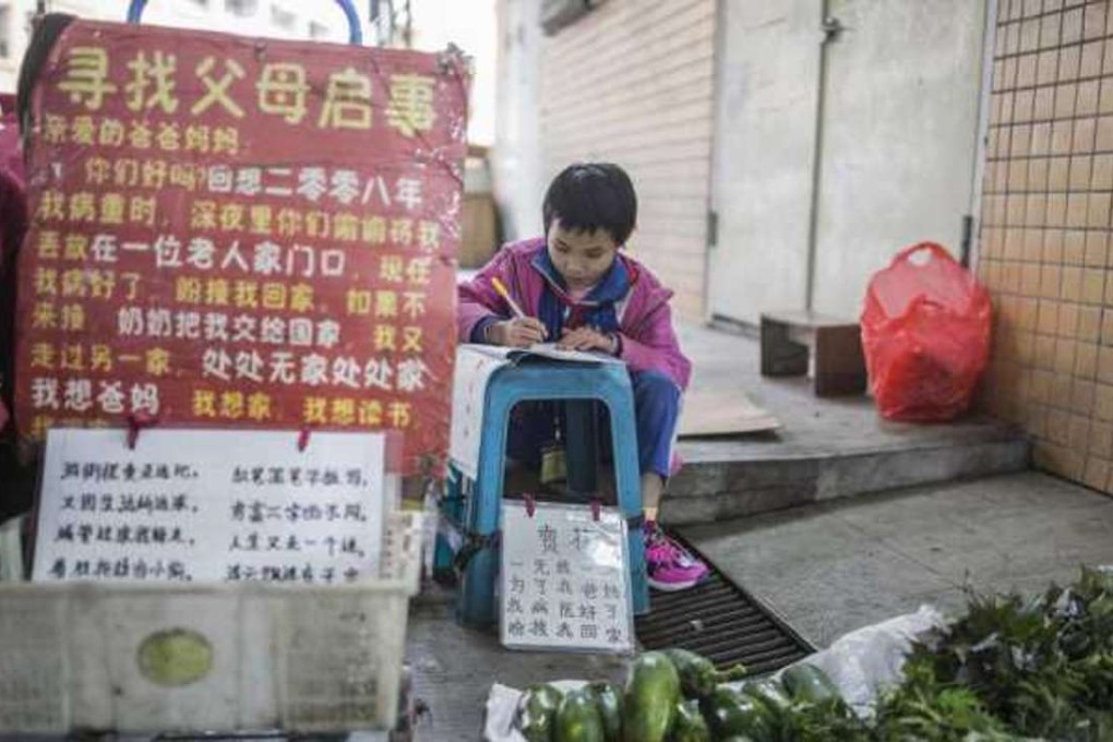 Nine-year-old Yang Xiuxia, sells vegetables after school in Dongguan. The notes on her store appeal for contact from her parents who left her as a newborn. Photo: Handout