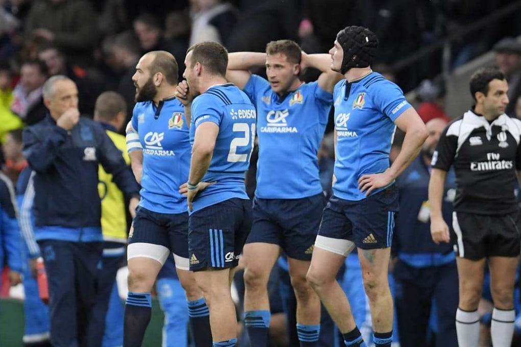 Italy’s Giorgio Bronzini and with teammates look dejected after the loss to England. Photo: Reuters