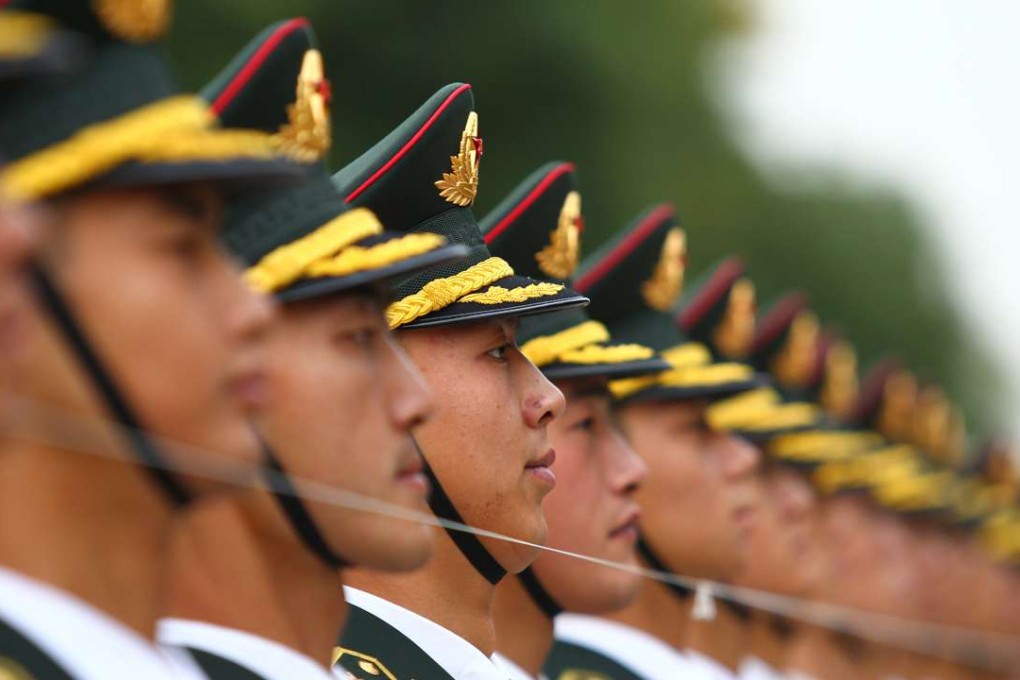 A file picture of a Chinese honour guard outside the Great Hall of the People in Beijing. Photo: Simon Song