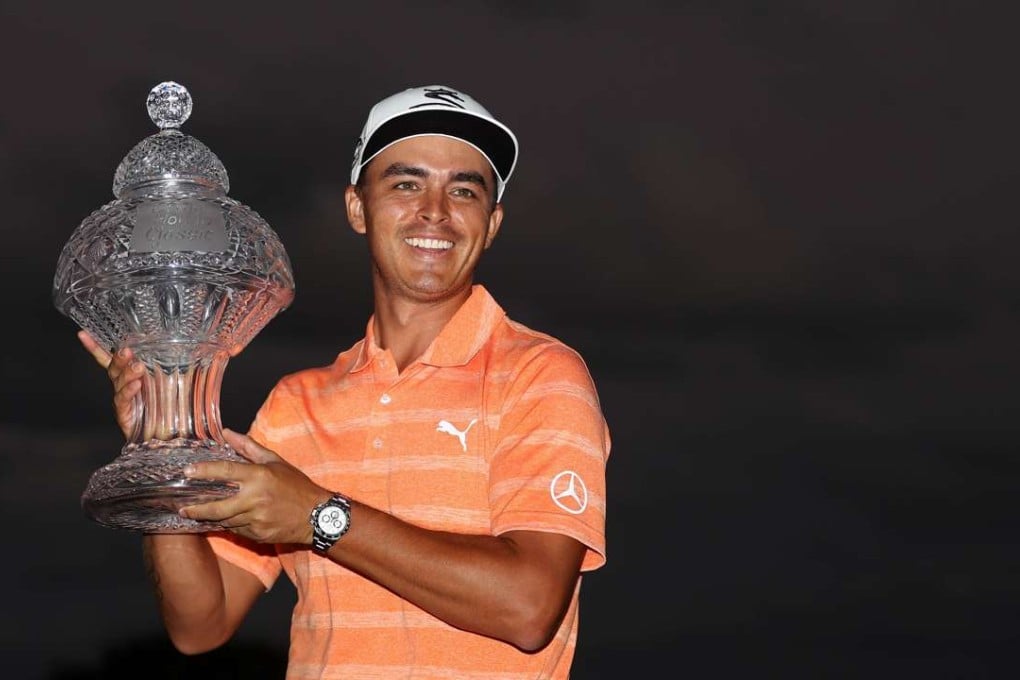 Rickie Fowler with the winner’s trophy after the final round of The Honda Classic at PGA National. Photo: AFP