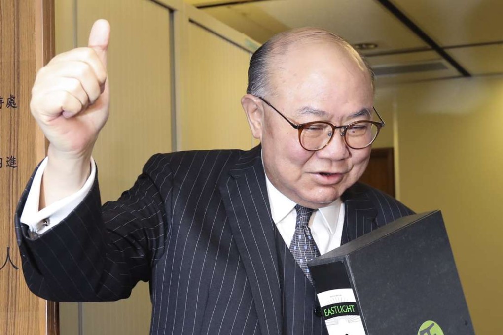 Woo Kwok-hing hands his nomination forms to election staff on Monday. Photo: Edward Wong