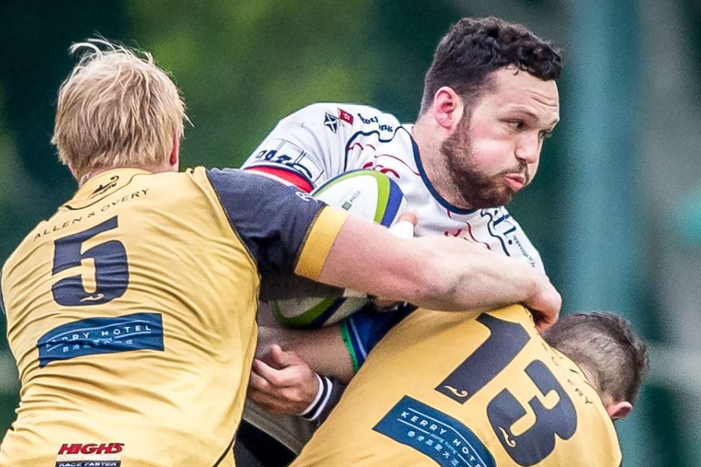 HK Scottish centre Conor Hartley feels the heat in his side’s quarter-final loss to the Borrelli Walsh USRC Tigers. Photo: HKRU