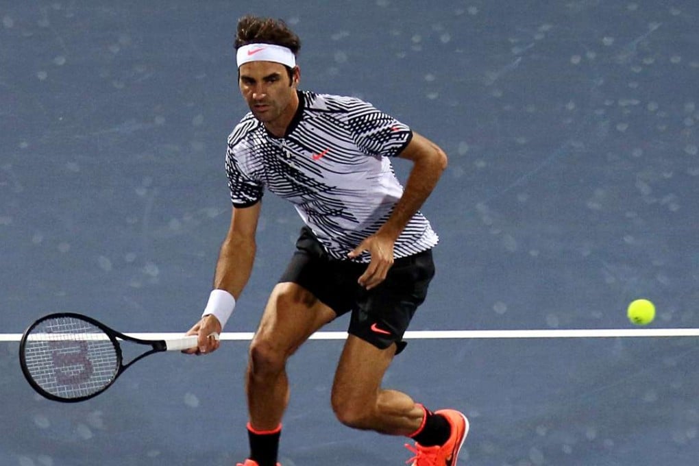 Roger Federer of Switzerland returns the ball to France’s Benoit Paire during his first round win. Photo: AFP