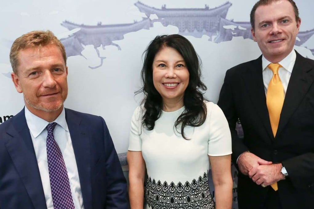 File photo of (L to R) Donald Skinner, global chief operating officer; Helena Wai, vice chairman; and Edmund Bradley, Global Head of Research of CLSA, during CLSA's 30th anniversary in September 2016. Photo: Jonathan Wong