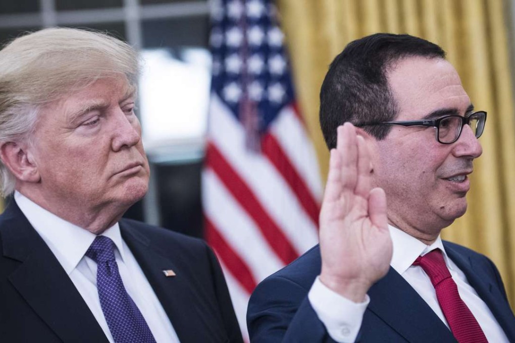 President Trump listens as former banker Steven Mnuchin is sworn in as Treasury secretary in the Oval Office on February 13. Photo: Washington Post