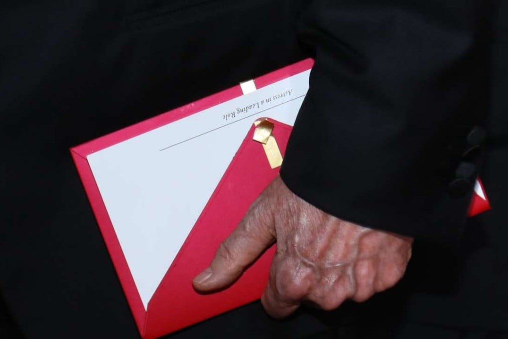Presenter Warren Beatty with the wrong envelope. Photo: Reuters