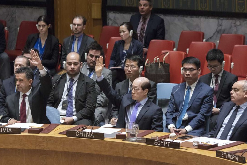 Chinese Ambassador to the UN Liu Jieyi (centre) votes against a UN Security Council draft resolution aiming to establish a sanctions regime over use of chemicals weapons in Syria at the UN headquarters in New York on Tuesday. Photo: Xinhua