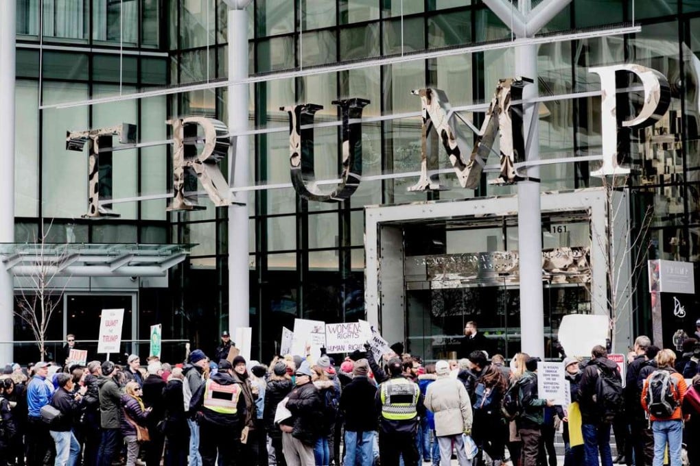 Protesters demonstrate in front of the Trump International Hotel and Tower in Vancouver during the hotel's opening on Tuesday. Photo: AFP
