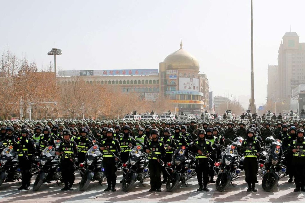 Police attend an anti-terrorist oath-taking rally in Hetian in the Xinjiang region, home to the Uygur ethnic group. Photo: AFP