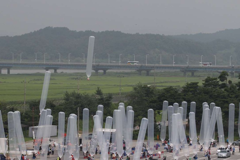 North Korean defectors and South Korean activists release balloons carrying chocolate pies and cookies in 2014. File photo: AP