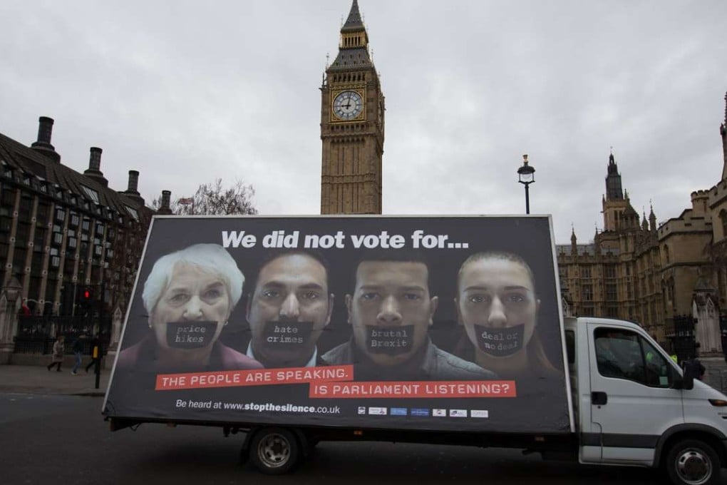 An advertising van with an anti-Brexit poster drives past the Houses of Parliament in central London. Photo: AFP