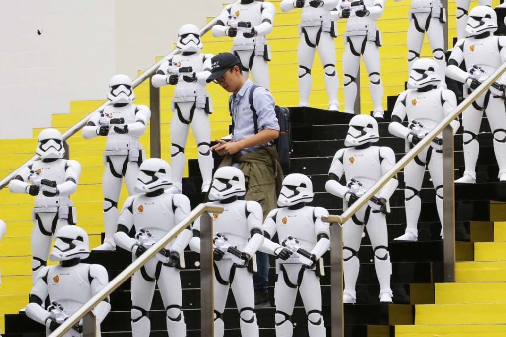 Huge figures of Stormtroopers from the Star Wars films stand guard at the The Legend of Hong Kong Toys exhibition in the Museum of History. Photo: Felix Wong
