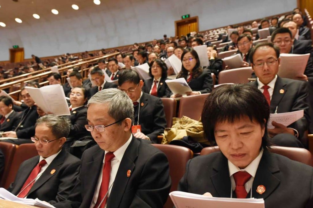 A survey found that 43 per cent of National People’s Congress deputies polled took more than three hours to go through China’s annual budget documents. Photo: Xinhua