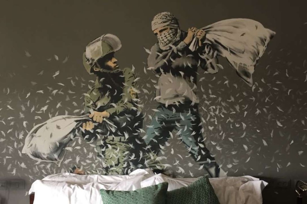 A bedroom in a new guesthouse in the West Bank city of Bethlehem that showcases artwork by Banksy. Photo: AP