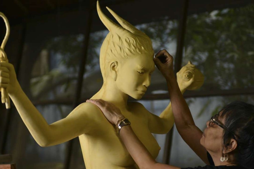 Agnes Arellano works on Project Pleiades, a series of sculptures based on goddesses in different cultures. Photo: courtesy of Art Fair Philippines