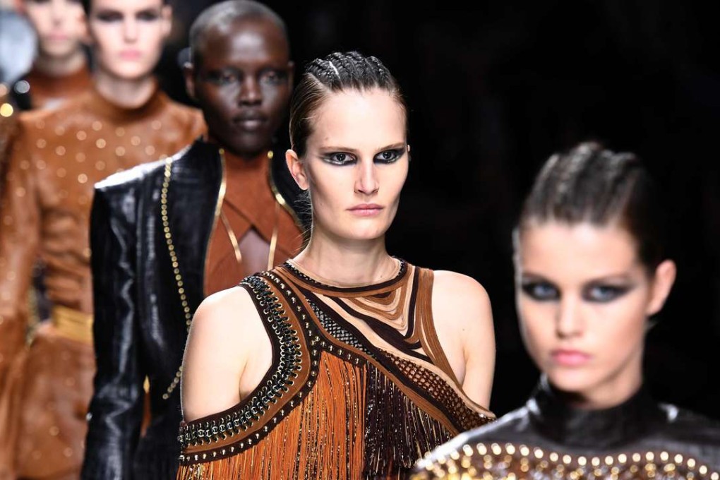 Models present creations by Balmain during the women's Fall-Winter 2017-2018 ready-to-wear collection fashion show in Paris. Photo: AFP
