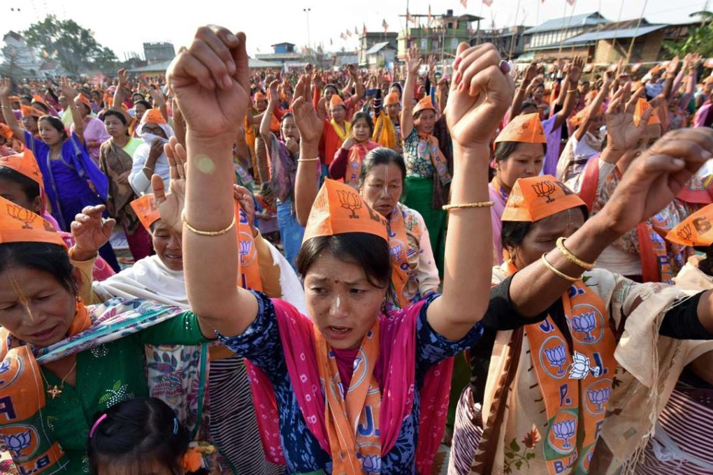 Supporters of the Bharatiya Janata Party shout slogans during an election rally at Wangkhem village in Thoubal district. Photo: AFP