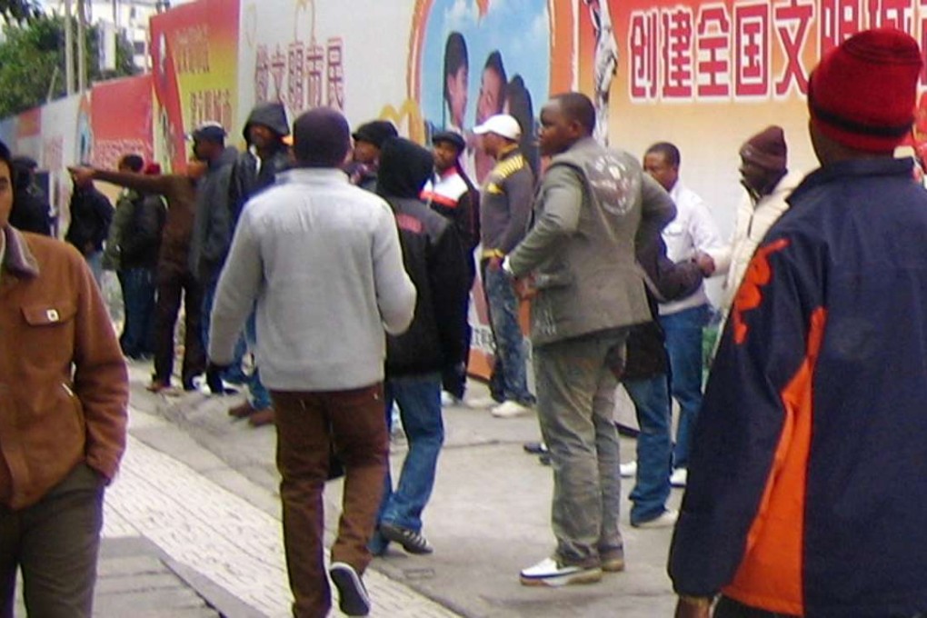 African traders walk on a street in Guangzhou. Photo: Handout