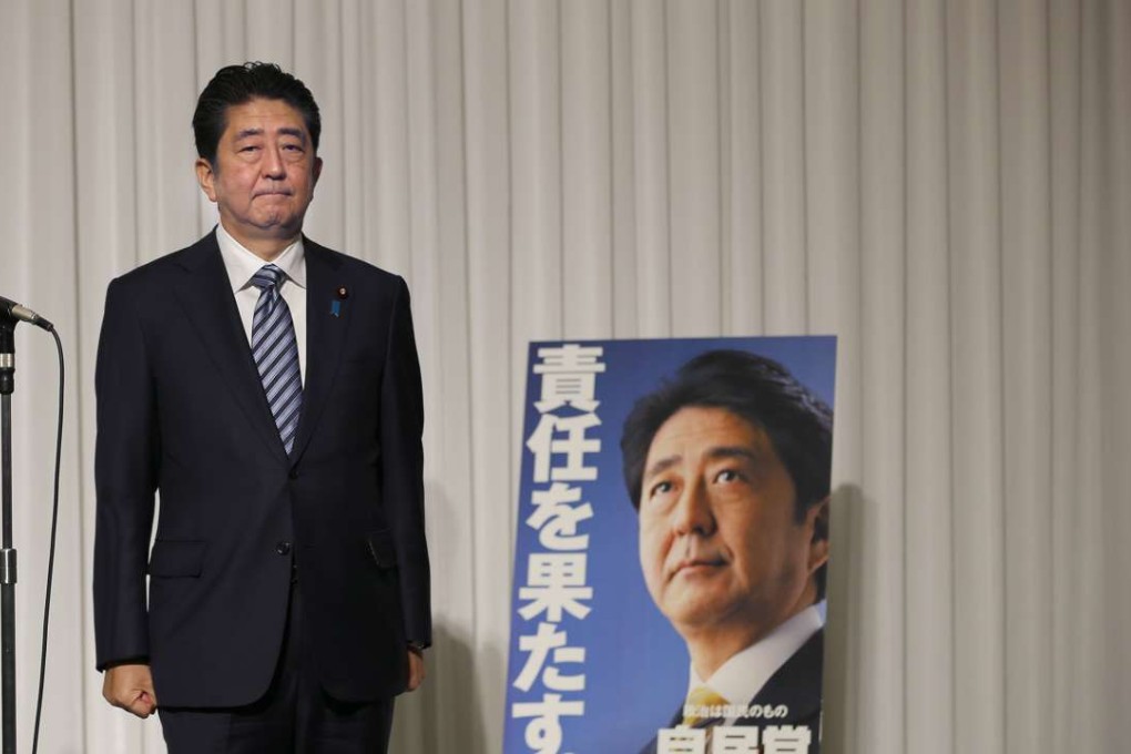 Japanese Prime Minister Shinzo Abe stands before the start of his ruling Liberal Democratic Party's annual convention at a hotel in Tokyo. Photo: AP