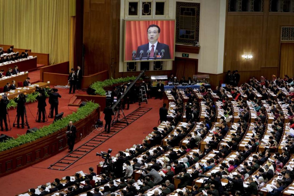 Chinese Premier Li Keqiang delivers his work report last year via video screen to the National People's Congress in Beijing. Photo: AP