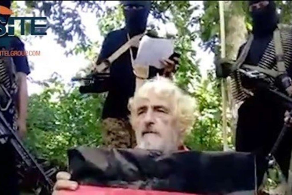 In this undated image made from militant video and released by SITE Intel Group shows German hostage Jurgen Gustav Kantner at an undisclosed location. Abu Sayyaf extremists in the Philippines beheaded Kantner. Photo: AP