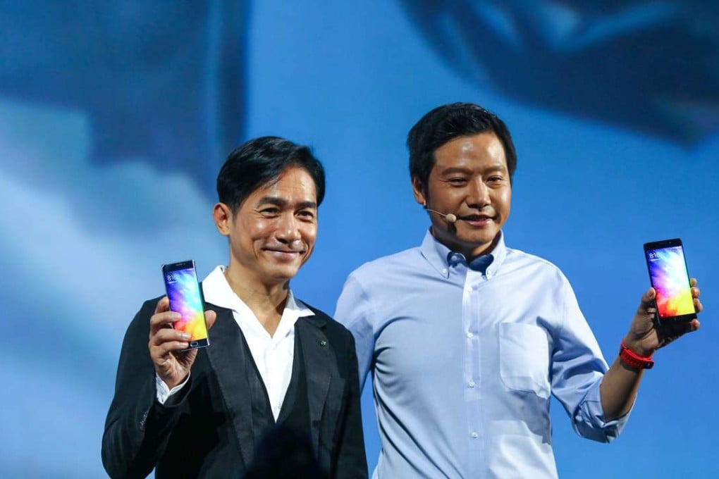 Hong Kong movie star Tony Leung Chiu-wai (left) and Xiaomi founder and CEO Lei Jun present Xiaomi Mi Note 2 in 2016. Phoro: Simon Song