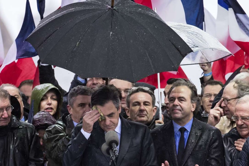 Francois Fillon (centre) delivers a speech to supporters on the Place du Trocadero in Paris on Sunday. Photo: EPA