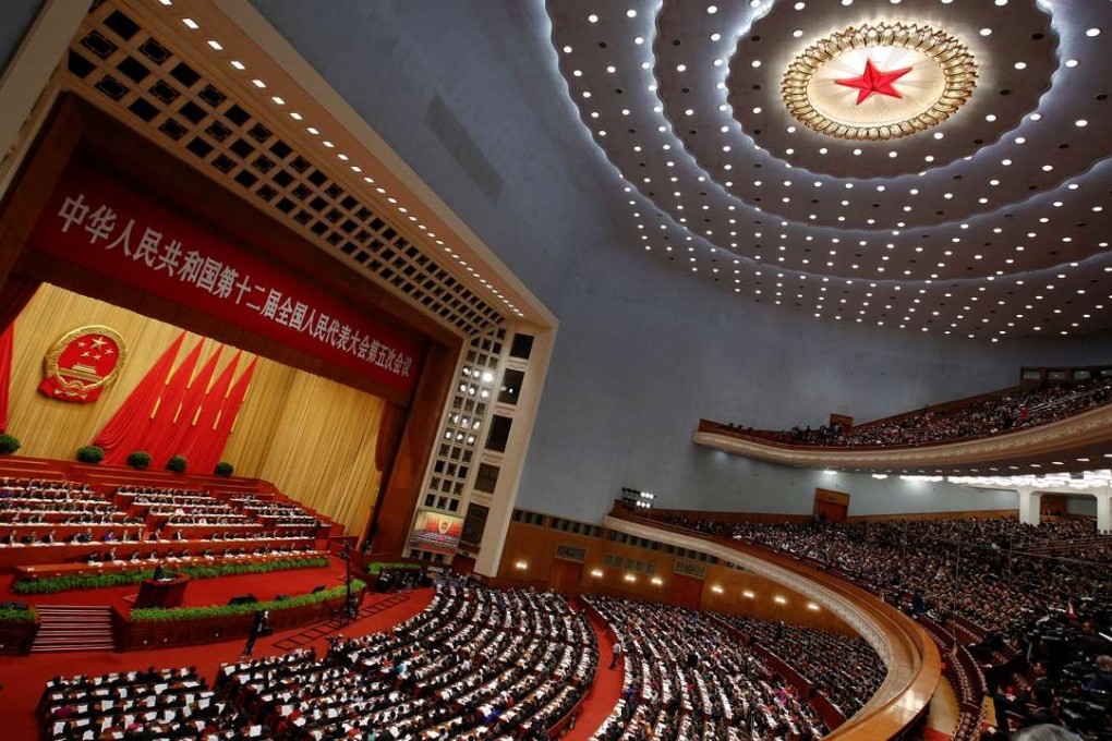 China's Premier Li Keqiang speaks during the opening session of the National People's Congress at the Great Hall of the People in Beijing on Sunday. Photo: Reuters