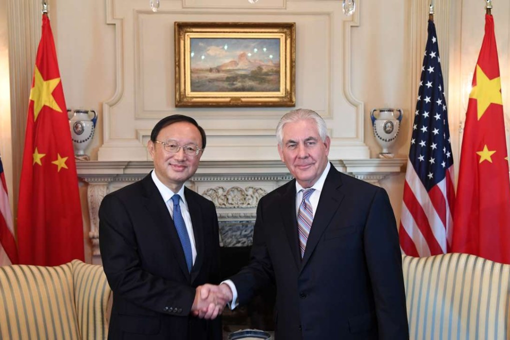 Chinese State Councillor Yang Jiechi (left) shakes hands with US Secretary of State Rex Tillerson during their meeting in Washington. Photo: Xinhua