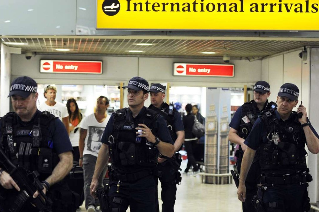 British police on patrol at Heathrow airport in London. Photo: EPA