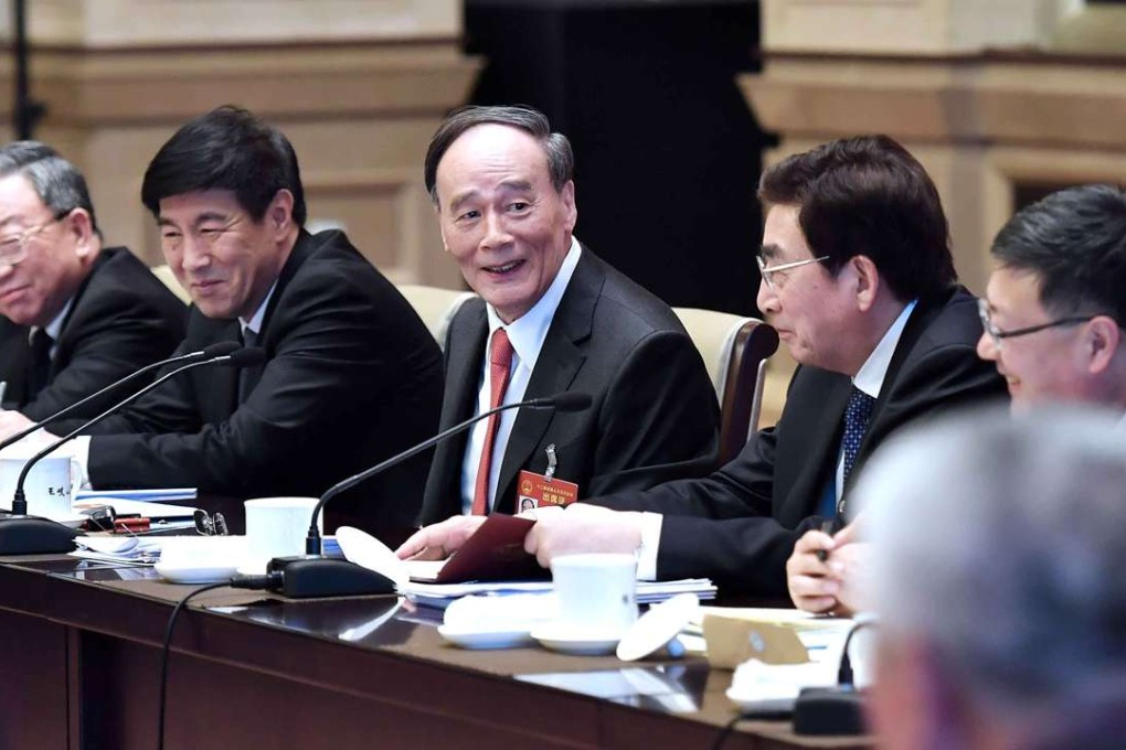 Top graft-buster Wang Qishan joins a panel discussion with Beijing deputies to the National People's Congress in Beijing on Sunday. Photo: Xinhua