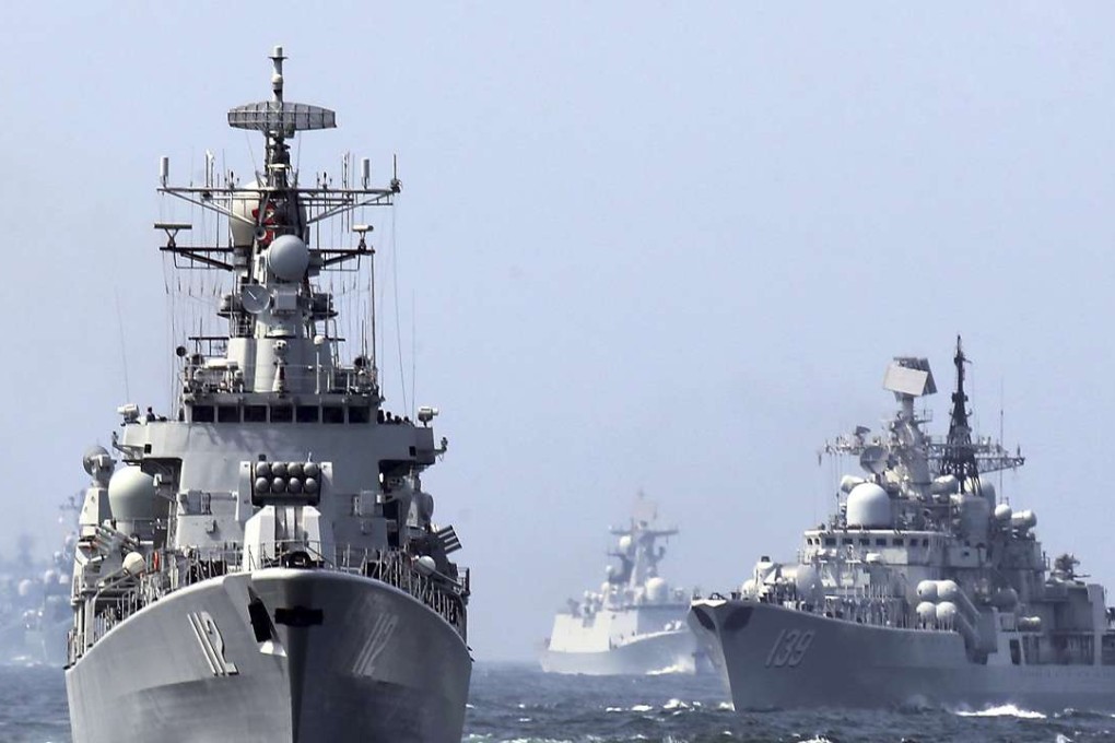 In this May 24, 2014, file photo, China's Harbin (112) guided missile destroyer and DDG-139 Ningbo Sovremenny class Type-956EM destroyer, right, take part in a week-long China-Russia "Joint Sea-2014" navy exercise at the East China Sea off Shanghai, China. A Chinese navy task force wrapped up visits to four Persian Gulf states as the increasingly capable maritime force grows its presence in the strategically vital region. The three ships, including Harbin, departed Kuwait on Sunday, Feb. 5, 2017, after stopping in Saudi Arabia, Qatar and the United Arab Emirates, the Defense Ministry said on its website Monday, Feb. 6, 2017. (Chinatopix via AP)