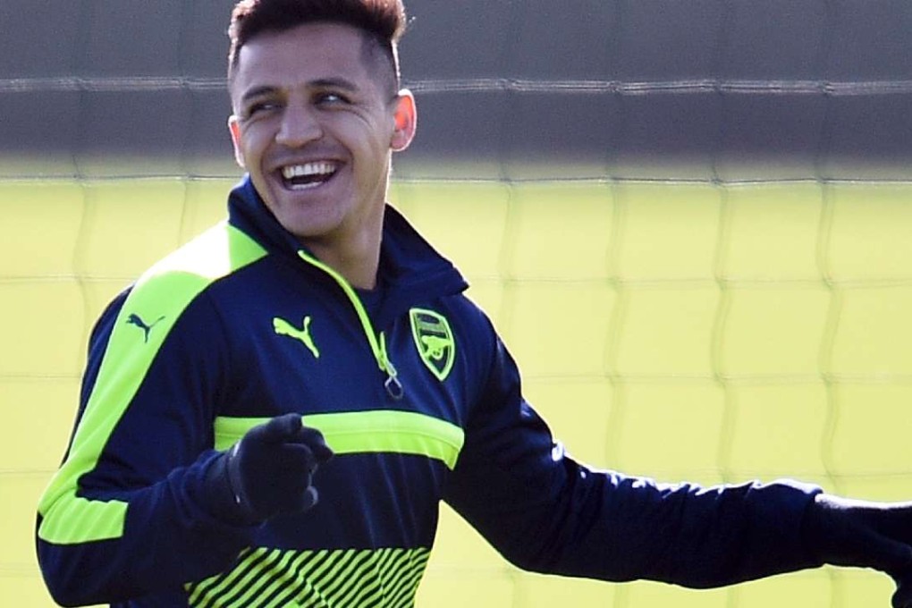 Alexis Sanchez is all smiles in training. Photo: AFP