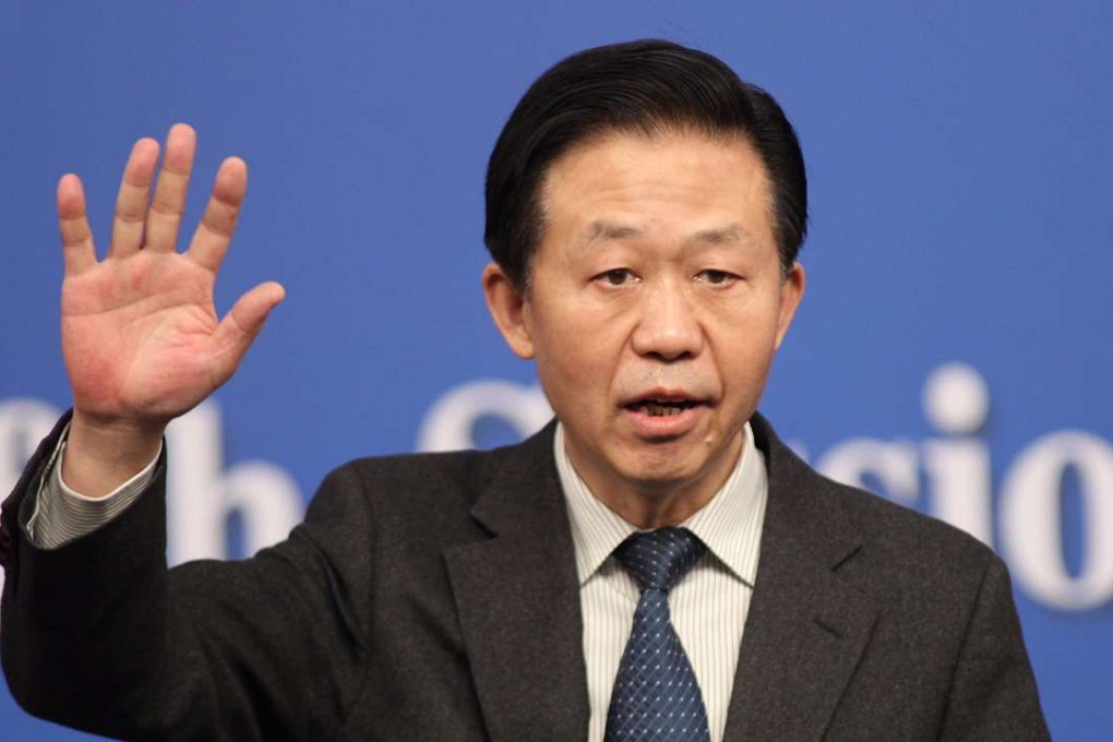 China's Finance Minister Xiao Jie answers a question at a press conference at the National People’s Congress in Beijing. Photo: Simon Song